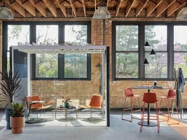 Enea Lottus bar-height stools are shown next to a Montara650 table beside an Orangebox Air23 pod with West Elm Slope Lounge Chairs and a Bolia Mix coffee table