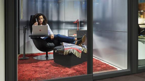 private work area with Massaud lounge and ottoman and small work table