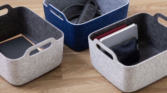 A Steelcase Flex Power Hanger and other items are shown in accessory baskets from the Steelcase Flex collection