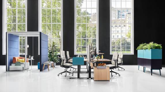 EMEA team bench with Implicit Lease and Please Anniversary at a Migration SE desk