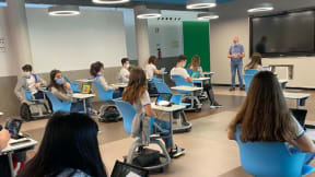 Students from the Colégio de Lamas, Portugal, attending class and sitting in Steelcase Node chairs