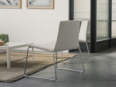 Montara650 Lounge Armless Chairs by a coffee table