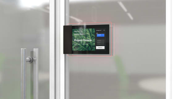 Roomwizard on a transparent door showing a booked meeting