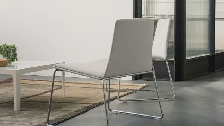 Montara650 Lounge Armless Chairs by a coffee table
