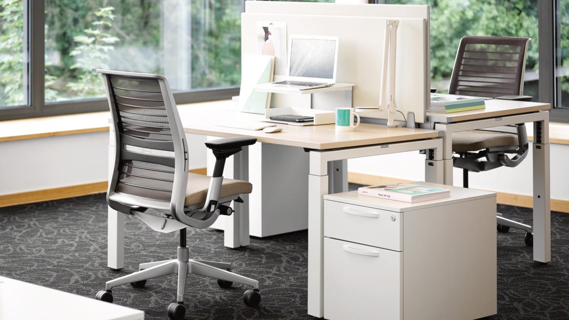 Implicit personal storage next to a FrameFour workstation and Think office chair