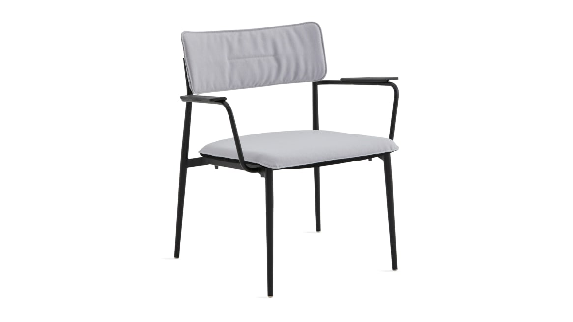 simple lounge chair with white cushion and black base