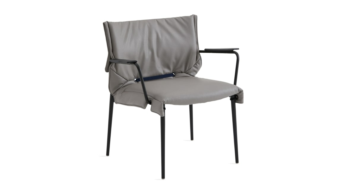 simple lounge chair with gray cushion and black base