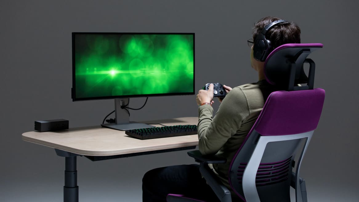 man sitting in a Gesture chair while playing videogames
