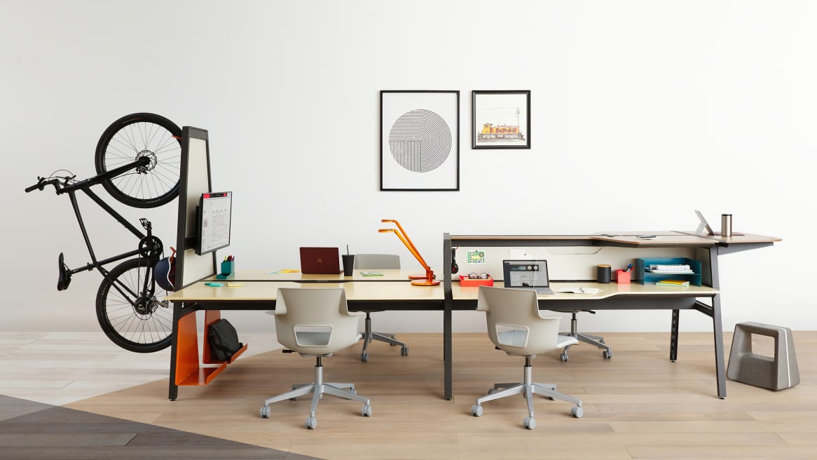 Workstations equipped with Turnstone Bivi Dual Height with a Turnstone Bivi Bike Hook and gray Steelcase Shortcut 5-Star Chair