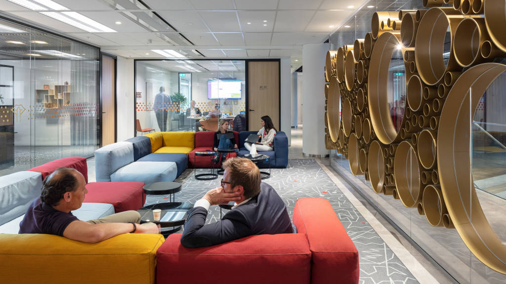 Men seated on a lounge area