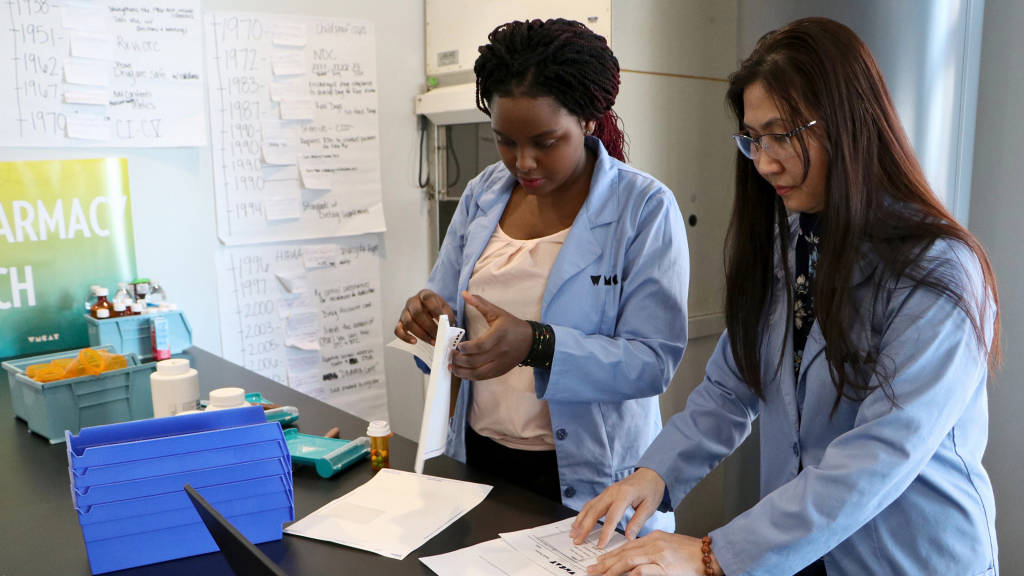 two women working inside a lab