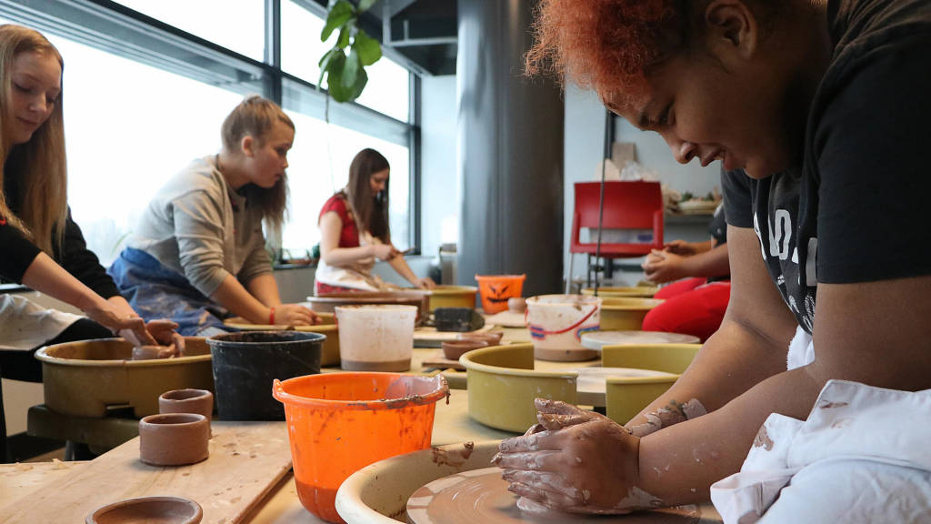 women doing clay figures