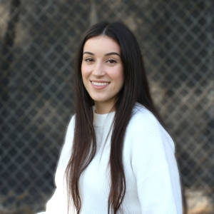photo of Next student participant smiling and wearing a white sweater